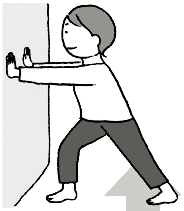 両腕を伸ばして壁に手のひらをつける。片足を後ろに引き、両足のかかとは床につける。前足のひざを軽く曲げ、後ろ足のアキレス腱を10〜20秒伸ばす。逆の足も同様に