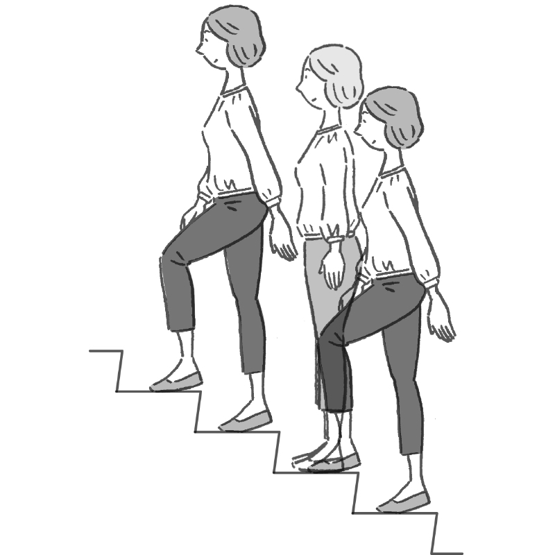 階段を登る女性