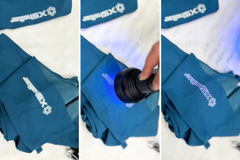 傘の表面にあるロゴに紫外線ライトを当てると…白から青色に変わった！