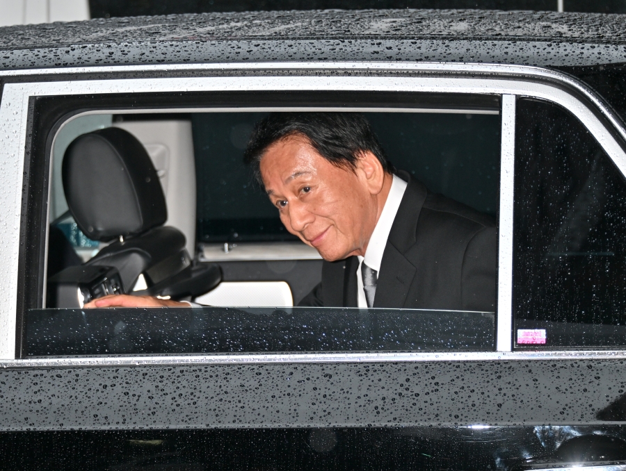 雨の中の訪問だった